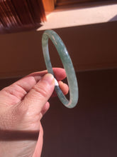 Load image into Gallery viewer, 57mm Certified Type A 100% Natural light green/blue/gray/brown with flying snow Guatemala slim round cut Jadeite bangle PD57-5536